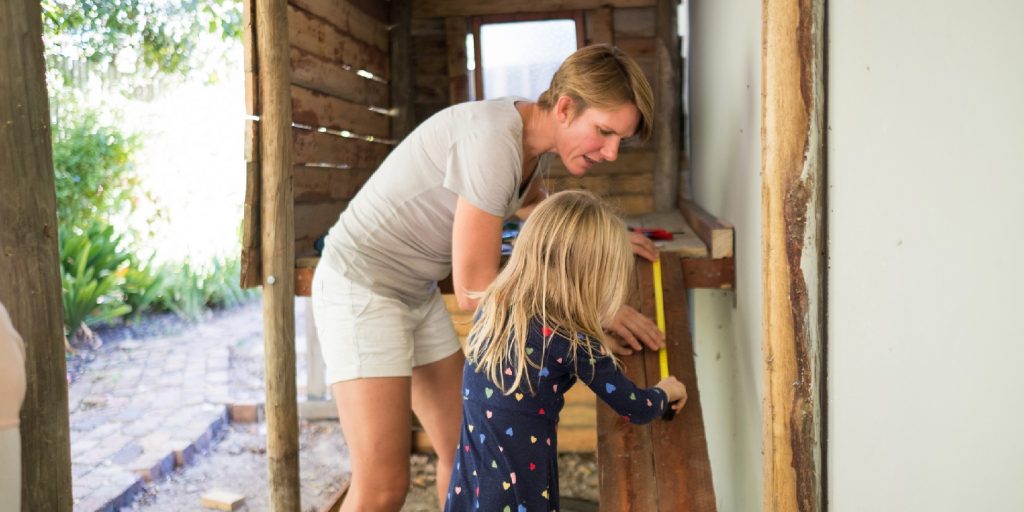 Mother and daughter busy with a home DIY project