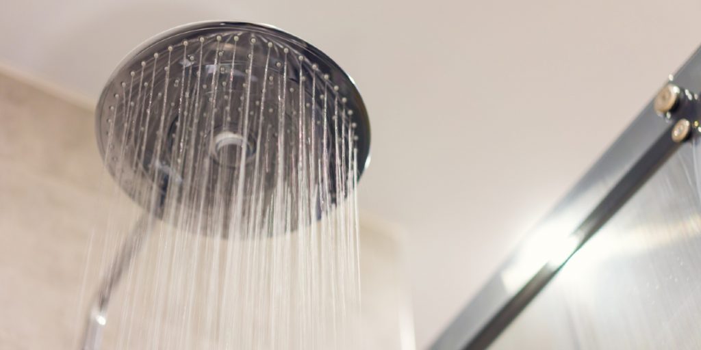 Close up of Water flowing from shower in the bathroom