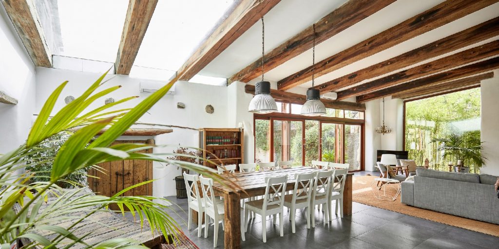 Spacious dining area in a bright refurbish Mediterranean farmhouse