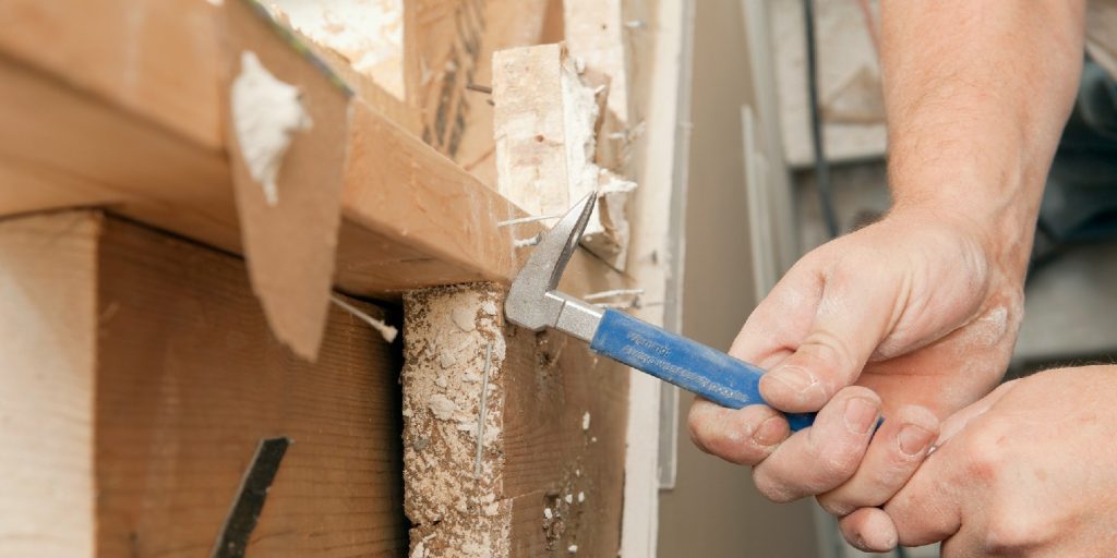 Carpenter Using a Nail Puller