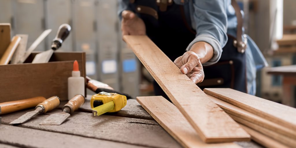 Carpenter Working with Lumber