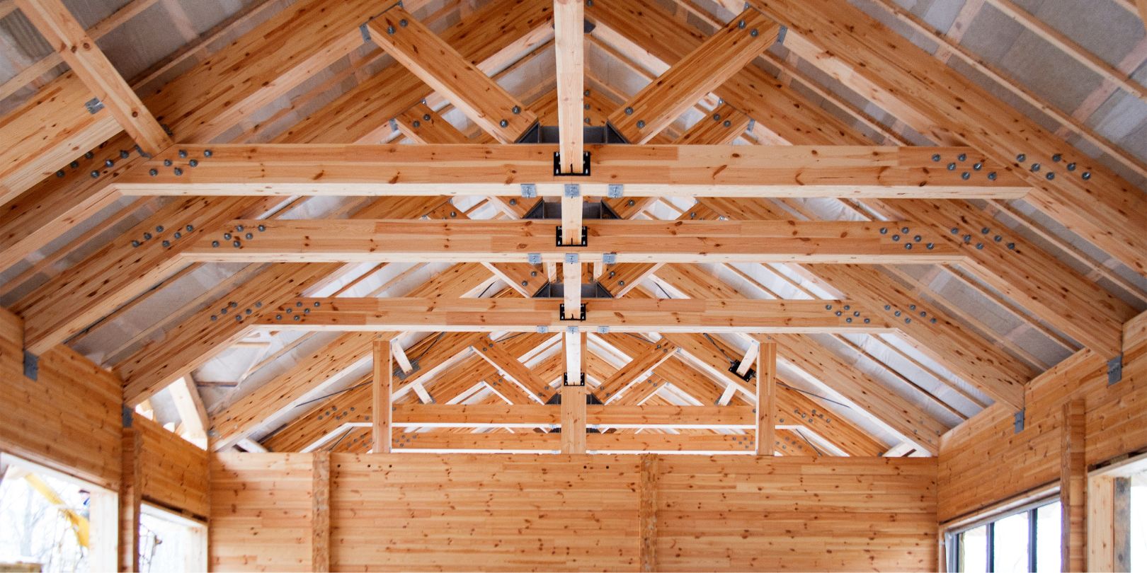 roof construction of big wooden trusses closeup