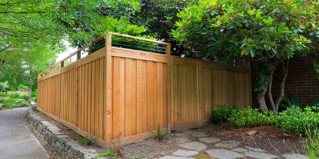 New Cedar Wood Fence around house side yard landscaping