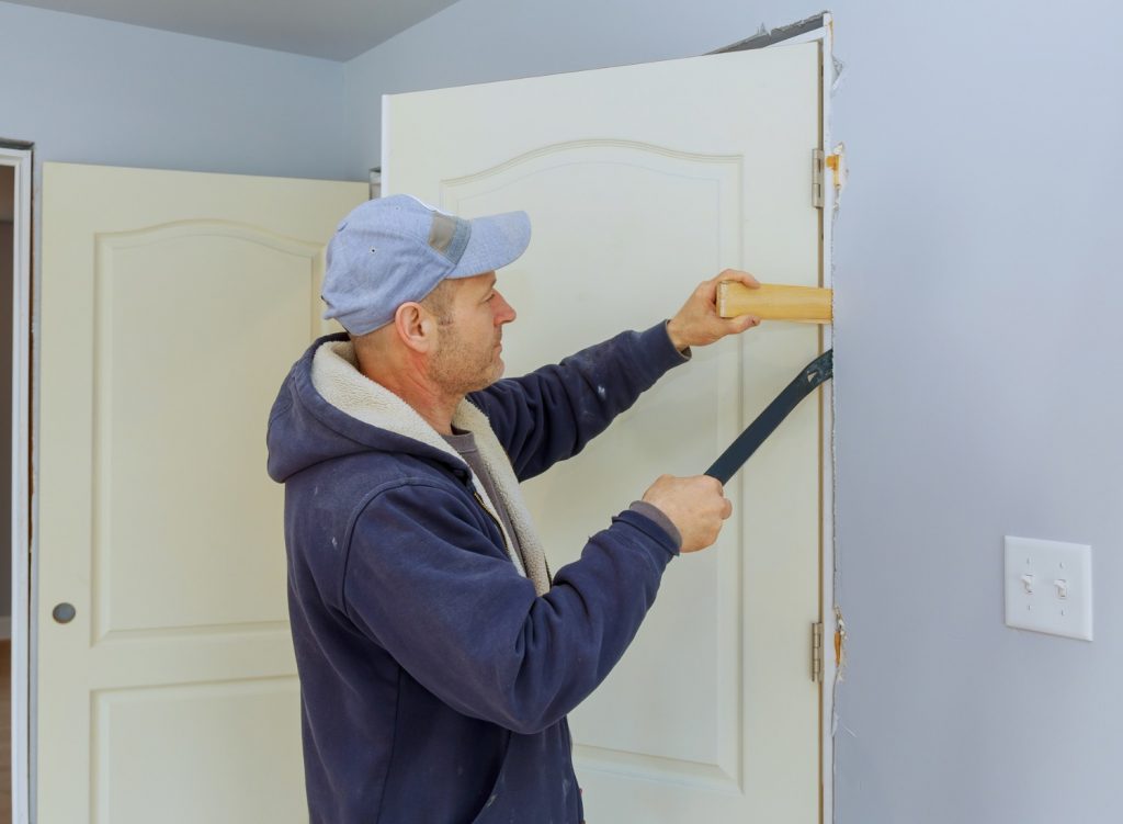 Man installing a door