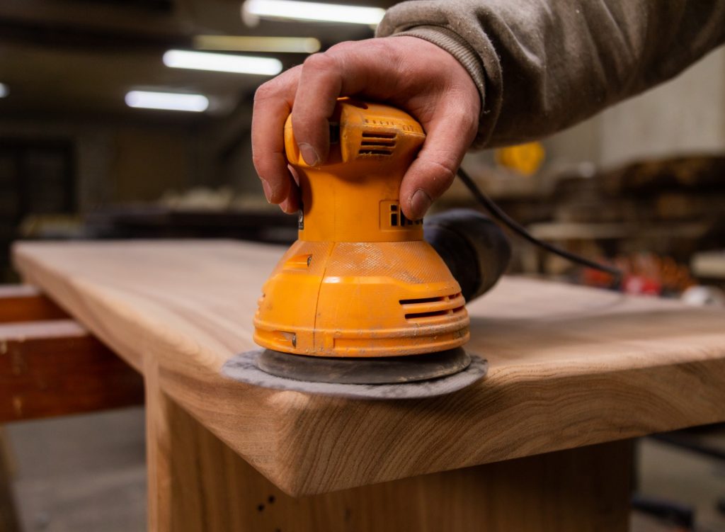 Man using an orbital sander