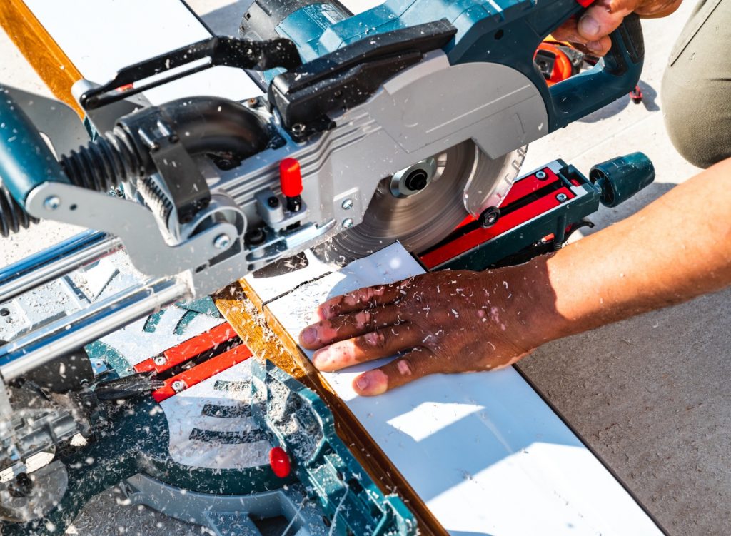 Man cutting wood with a miter saw