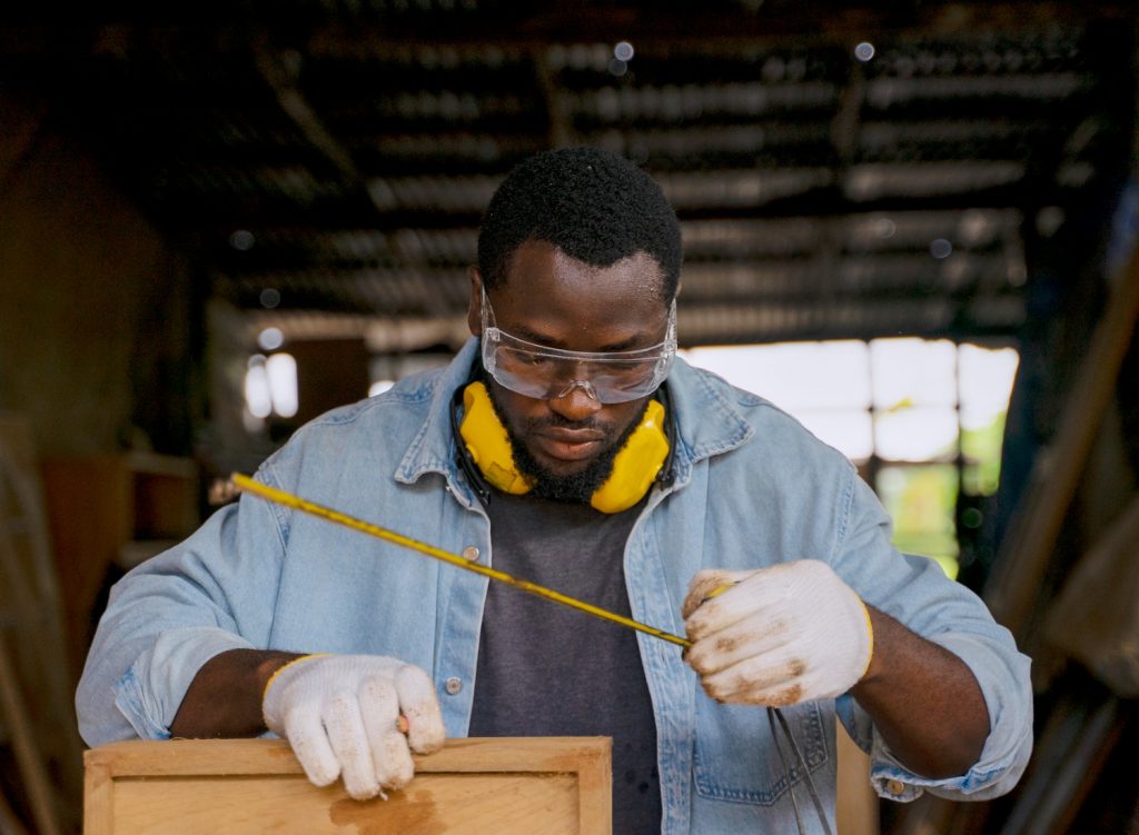 Carpenter reading a tape measure