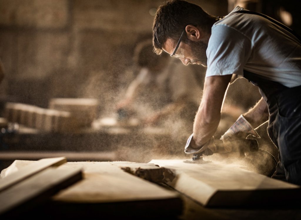 Carpenter using a sander