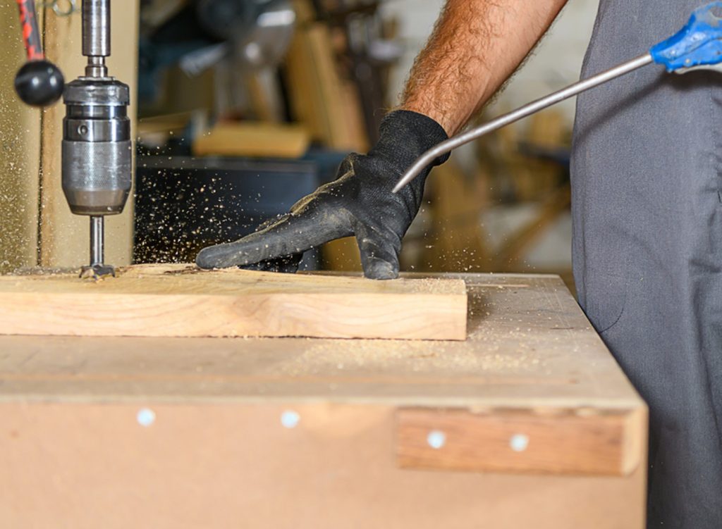 Man woodworking with an air compressor